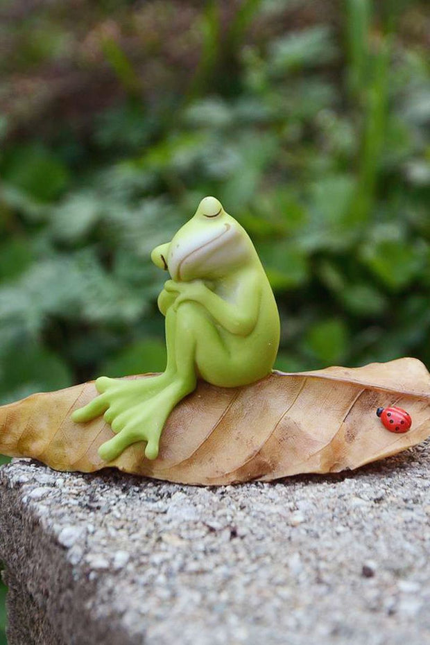 Frog Napping on Leaf with Ladybug