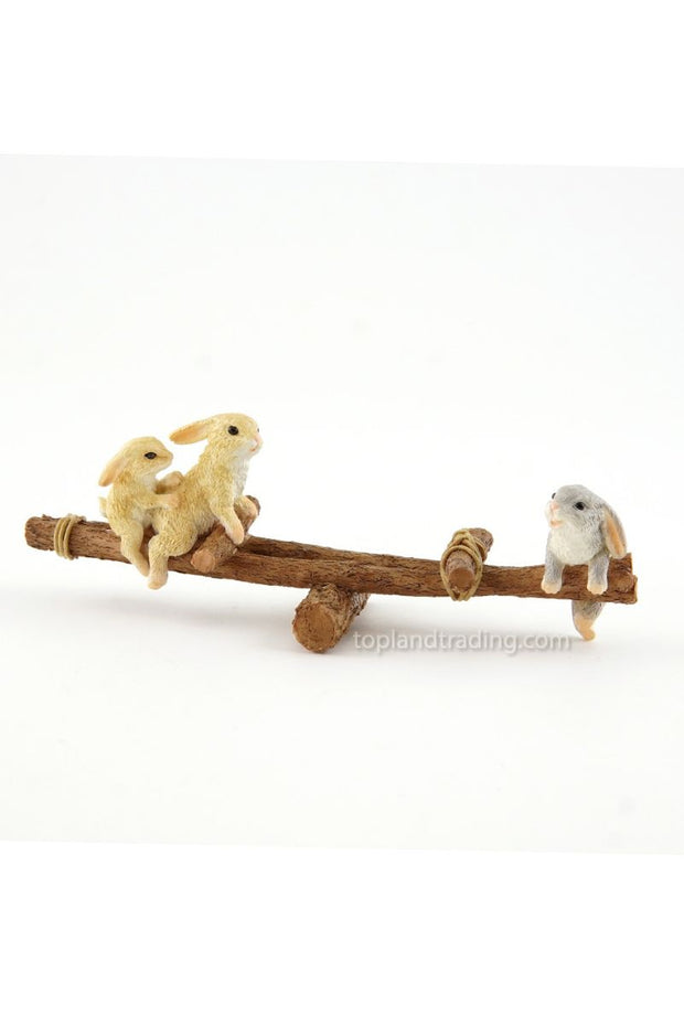 Rabbits Playing on Wooden Seesaw